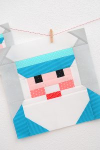 12 Inch Captain quilt block hanging on a wall