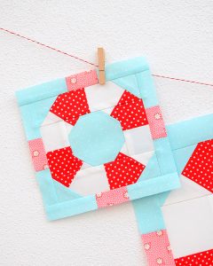 6 Inch Lifesaver quilt block hanging on a wall