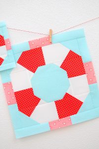 12 Inch Lifesaver quilt block hanging on a wall