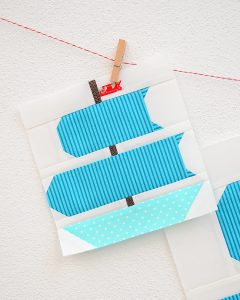 6 Inch Sail boat quilt block hanging on a wall