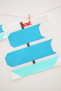 12 Inch Sail boat quilt block hanging on a wall