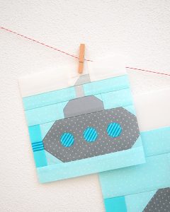 6 Inch Submarine quilt block hanging on a wall