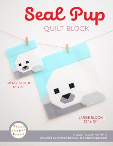 Seal Pup quilt block in two sizes hanging on a wall