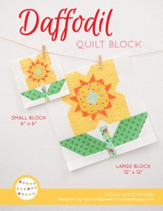 Daffodil quilt block in two sizes hanging on a wall