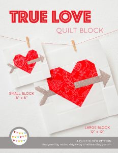 Cupid's Arrow Heart quilt block in two sizes hanging on a wall