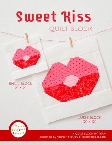 Lips quilt block in two sizes hanging on a wall
