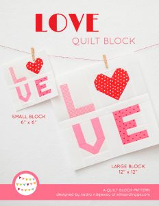 Love Sign quilt block in two sizes hanging on a wall
