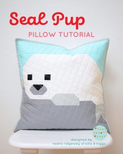 Quilted pillow with a seal pup design