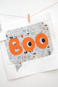12 Inch Boo quilt block hanging on a wall
