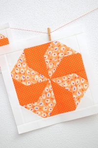 12 Inch Candy quilt block hanging on a wall