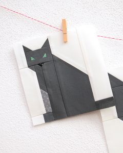 6 Inch Cat quilt block hanging on a wall