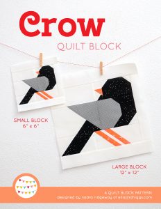 Crow quilt block in two sizes hanging on a wall