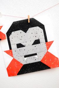 12 Inch Dracula quilt block hanging on a wall