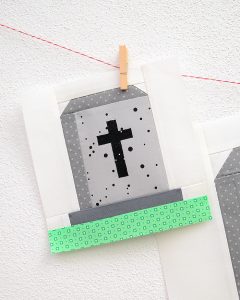 6 Inch Gravestone quilt block hanging on a wall