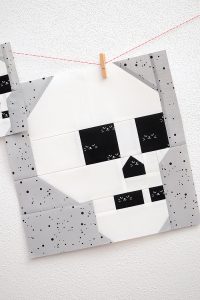 12 Inch Skull quilt block hanging on a wall