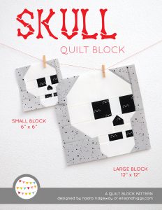 Skull quilt block in two sizes hanging on a wall