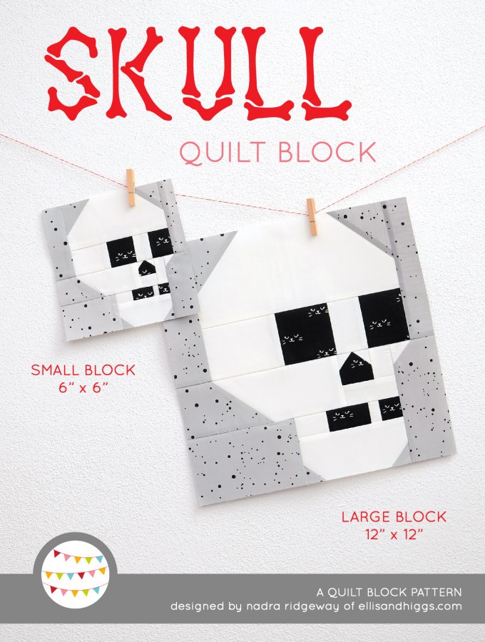 Skull quilt block in two sizes hanging on a wall