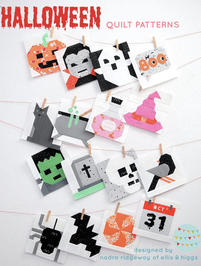 Sixteen Halloween quilt patterns hanging the wall.