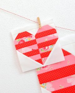 6 Inch Heart quilt block hanging on a wall