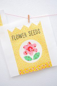 12 Inch Flower Seeds quilt block hanging on a wall