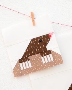 6 Inch Mole quilt block hanging on a wall