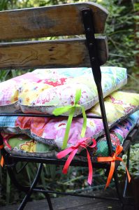 Patchwork pillows on a garden chair