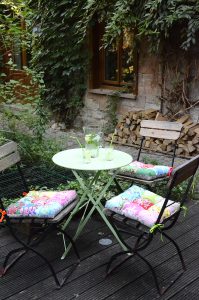 Beautiful Patio - patchwork pillows on garden chairs