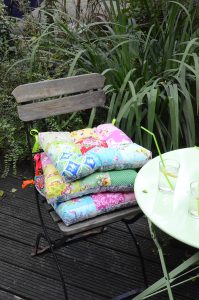 Patchwork pillows on a garden chair