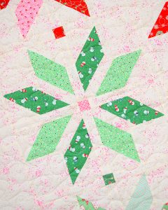Green star quilt block in a Christmas quilt