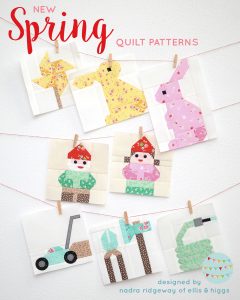 Spring quilt blocks hanging on the wall